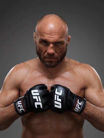 Portrait of Randy Couture in UFC gloves.
