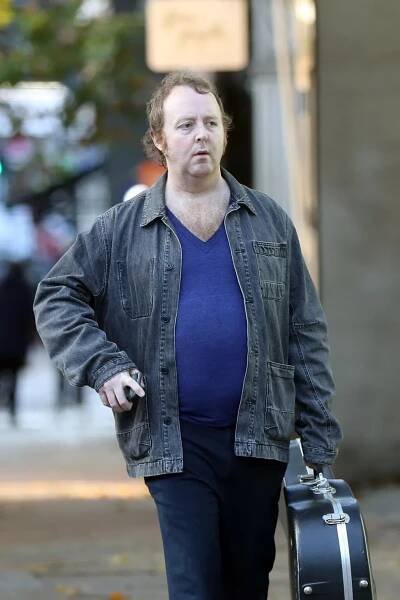 Paul McCartney’s lookalike son James pictured grabbing a coffee with guitar - The Mirror