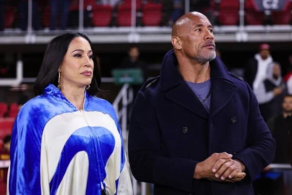 L-R) XFL owners Dany Garcia and Dwayne Johnson watch an XFL game between the DC Defenders and the Seattle Sea Dragons at Audi Field on February 19, 2023 in Washington, DC.