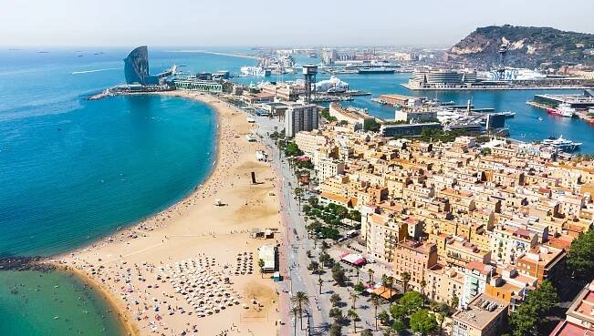 Aerial view of Barceloneta Beach and the Barcelona coastline.