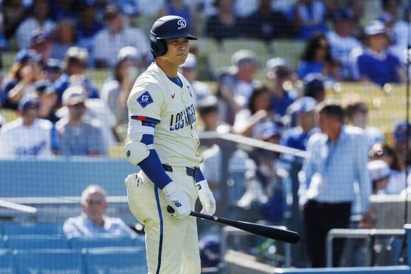 LOS ANGELES, CA - JULY 5, 2025: Los Angeles Dodgers two-way player Shohei Ohtani (17) stands near the on-deck circle after putting on his batting gear after pitching the first inning against the Houston Astros at Dodger Stadium on July 5, 2025 in Los Angeles, California.(Gina Ferazzi / Los Angeles Times)