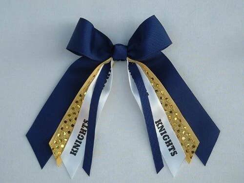 Add a touch of style with this custom hair bow featuring streamers. Perfect for girls, teens, and women.