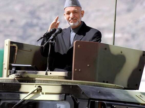 Karzai escapes again as Taliban attack parade