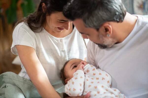 Happy Loving Couple Holding Baby Son and Looking at Him Stock Photo - Image of male, concept: 244321808