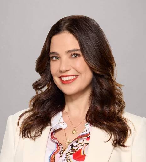 In a compelling episode late in Season 1 of “Lopez vs. Lopez,” a character tries to stymie a fellow Latina mom in her social circle rather than lift her up. George Lopez finally tells Mayan Lopez that there’s a term for that kind of behavior. “She’s a bucket crab,” he explains. “It’s like when Latinos try to pull each other down, like crabs in a bucket.” Think of “Lopez vs. Lopez” as the direct opposite of such crabbiness. As the working-class family comedy barrels toward its Season 2 premiere on NBC this April 2, the show is all about pulling each other up – and maybe helping those with bigger dreams to cross a few things off their bucket lists. Debby Wolfe, the show’s executive producer and co-creator, grew up in Miami at a time when Latine characters were almost impossible to find on network television, let alone in prime time. In a wide-ranging interview with the Geena Davis Institute last month, Wolfe said she remembers seeing a PBS show as a kid called “Que Pasa USA” which ran from 1977-80. But other than that, it was a mostly barren landscape for Latino representation in those days. So it comes as a profound milestone for Wolfe that the authentically Latino stories of “Lopez vs. Lopez” will resume with back-to-back episodes at 8 p.m. and 8:30 p.m. Tuesdays this spring. In the meantime, anyone looking to get caught up can find all 22 episodes of Season 1 on Netflix. “It’s been really amazing to see how supportive our audience has been and how much they relate,” Wolfe said. “Whenever we do panels, people always come up to us and say, ‘You know, I see myself in these characters. I see my family in these characters.’ It’s not lost on me how much specifically Latine TV viewers want to see themselves on screen.” The cast: Selenis Leyva, Al Madrigal, George Lopez, Mayan Lopez, Matt Shively and Brice Gonzalez (Photo: Carlos Eric Lopez/NBC) That representation applies to both sides of the camera, which of course aligns with the mission of the Geena Davis Institute on Gender in Media. The goal of GDI is to reinvent, transform and inspire how global content creators and media tell stories through authentic portrayals of the population in entertainment. “Lopez vs. Lopez” is that kind of show, from the writers’ room to the actors and beyond. “We’re the only network comedy with a predominantly Latine cast,” Wolfe said. “There’s so little offered to us. And so I take that very seriously. I am trying to make the best show possible. And I’m hoping that we continue to be a big hit so that we can open the doors for more.” “Lopez vs. Lopez” serves as a vehicle for the real-life father/daughter combination. George Lopez, the stand-up comedy legend, plays the owner of a struggling moving company whose financial straits force him to move in with his Gen Z daughter Mayan. From there the show riffs off cultural differences, the age gap and family dysfunction. For all the jokes, however, the show also delves into serious territory on a regular basis. The Season 1 finale focused on George Lopez’s struggle to curb his drinking (“Lopez vs. Last Call”). Earlier episodes came with titles like “Lopez vs. Anxiety,” “Lopez vs. Gaslighting” and “Lopez vs. Appropriation.” The pain, like the laughs, comes from a real place. “We tackle mental health. We tackle alcoholism, toxic masculinity. We always do it with humor,” Wolfe said. “And I think that comes naturally, especially coming from being Salvadorian and also half-Jewish. You know, I think that the generational trauma and the oppression that my family’s faced has made us a very funny family. We’ve gone through a lot. We know how to laugh at it. “And I think everyone in my room can speak to that, too.” Indeed, one of the perks of having so much diversity in the writers’ room is that the stories can come from a place of truth. “That’s how you avoid stereotypes” Wolfe said. “Authentic storytelling is our bread and butter.” George and Mayan are among those who contribute storylines that actually happened within their family, but the show draws from a deep well of other staffers. “You know, half of my room is Latine, including me, but we’re from different cultures,” Wolfe said. “My mother was Salvadorian. And then I also have Mexicans in the room. I have Cubans in the room. “But we all share similar experiences. So when we find what those gems that we all share are, we’re like, ‘OK, we have something here.’ But it’s always coming from real life.” George Lopez, Mayan Lopez and Selenis Leyva Wolfe is also cognizant of making sure there are parents in the room, to make sure the family dynamics ring true. Omar Ponce, the executive story editor for 13 episodes, has a son who is the direct model for the Chance character played by Brice Gonzalez, the 9-year-old actor and TikTok star. Embracing one’s roots is a lesson Wolfe learned long ago. As part of her early career journey, she participated in NBC’s “Writers on the Verge” program as well as NALIPs Writer’s Lab program. One of her big breakthroughs was when she had a short film called “Gordita” play at the NBC Diversity Festival. Looking back, Wolfe said those writer programs helped pave the way for her career. “I’ve been very fortunate to have some amazing television mentors,” she said. Now, Wolfe continues to push the community by encouraging young talents to rise up. She feels a responsibility to pay it forward in terms of mentorship. “It’s definitely important to me to hire as much Latine staff, crew, writers as I can, so that they can rise up,” “Because if you don’t have representation behind the screen, you won’t have it on screen. So that’s not lost on me.” She recalled how in the first season of “Lopez vs. Lopez,” she would put some of her young writers in the spotlight to celebrate their voices. She’d walk out to one of those boisterous live audiences and announce the names of the scribes behind the scripts. “And everyone cheers,” Wolfe said. “Being able to give that gift to young writers, ohhhh, just nothing feels better.” There should be plenty more to cheer in Season 2. Confirmed guest stars this season include Gabriel “Fluffy” Iglesias, Diana Maria Riva and former NFL star Marshawn Lynch. All in all, not a bad haul for a showrunner with a vivid memory of revealing her comedic career plans to her mother – and getting heckled. “When I actually told my mom I was going to be a comedy writer, she said I wasn’t funny,” Wolfe said with a laugh. “So I stick it to my mom with this show.” For the record, Wolfe’s mom is no crab: “She’s very proud. She’s a Salvadorian mother. She’s got to keep me humble.”