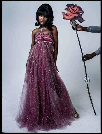 Saniyya Sidney wears a Giorgio Armani dress; Bulgari necklace; Celine by Hedi Slimane bag and sandal...
