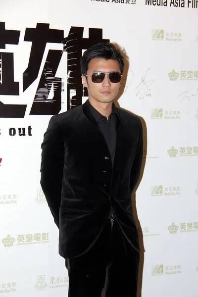 Hongkong zpěvák a herec Nicholas Tse představuje během premiéry pro jeho nový film, jako The světlo jde ven, Hong Kong, Čína, 19. prosince 2013. — Stock obrázek