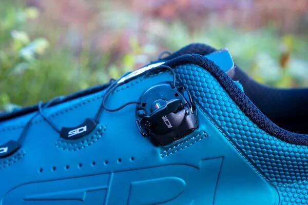 Sidi Dust MTB shoes on a wooden stump