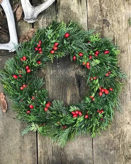 Christmas Wreath with Red Berries and Green Leaves