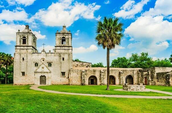 old fort surrounded by green trees historical sites in texas