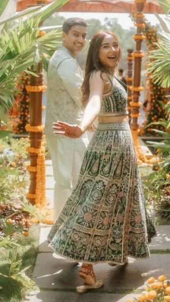 Prajakta Koli and Vrishank Khundal’s glamorous pre-wedding ensembles by Anita Dongre