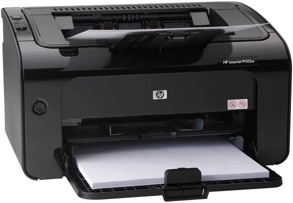 a black printer sitting on top of a white table