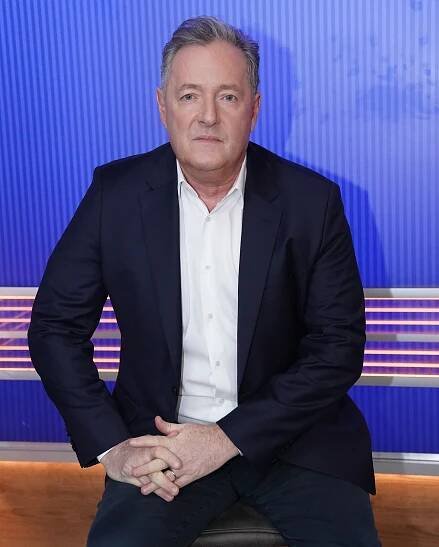 Piers Morgan in a suit during an interview.