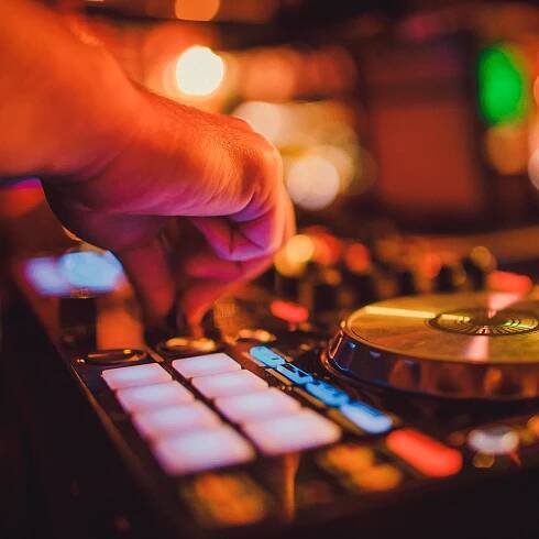 dj with mixing board