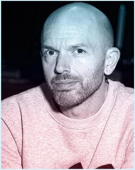 Paul Scheer with a bald head and scraggly beard and mustache