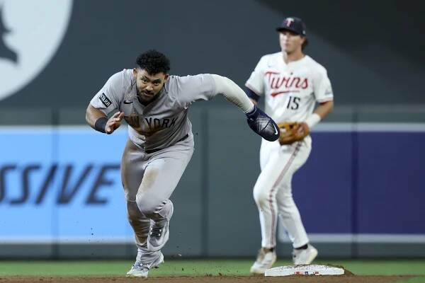 Jasson Domínguez #24 of the New York Yankees advances to third base on a throwing error on his stolen base at second against the Minnesota Twins in the eighth inning at Target Field on September 17, 2025 in Minneapolis, Minnesota.