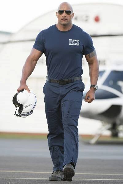 a man with a helmet walking down the street