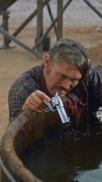 Chuck Connors, Burl Ives uses a Single Action Army. Gregory Peck. The Big Country (1958).