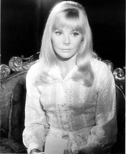 Black and white photo of Barbara Ferris in a white eyelet blouse.