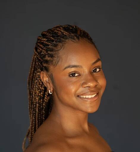 Ashley Johnson - Ashley Johnson, an African American woman with dark brown hair and brown eyes.
