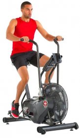 Exercise bike with man riding it.