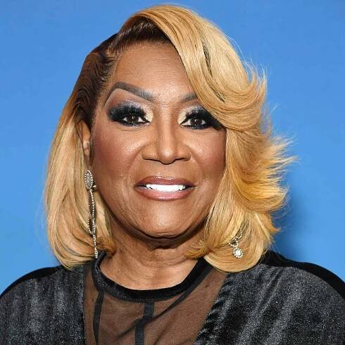 Patti Labelle wears a blonde layered bob hairstyle with side part