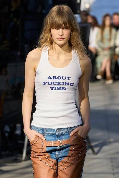 a person wearing a white tank top