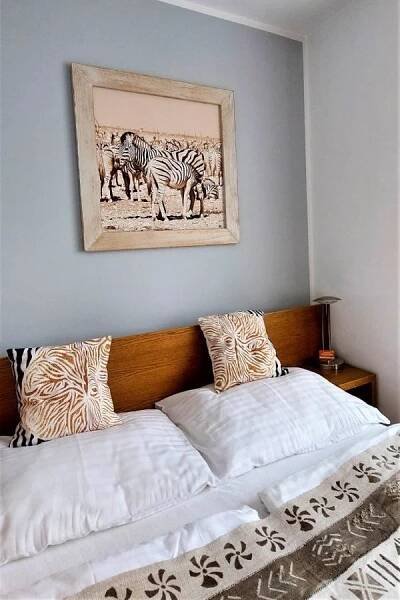 Postel nebo postele na pokoji v ubytování Afrika Hotel Frýdek-Místek