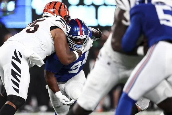 Orlando Brown Jr. blocks Elijah Chatman during an NFL game at MetLife Stadium on October 13, 2024 in East Rutherford, New Jersey.