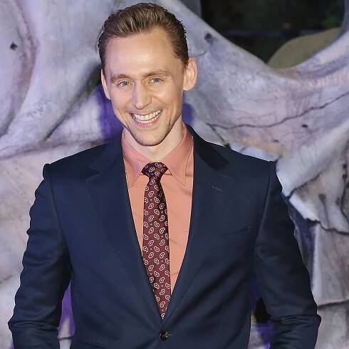 Tom Hiddleston’s Shirt is the Perfect Shade of Un-Preppy Pink