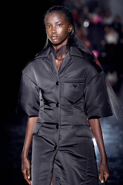 Image may contain Clothing Apparel Human Person Coat Fashion Jacket Sleeve and Runway