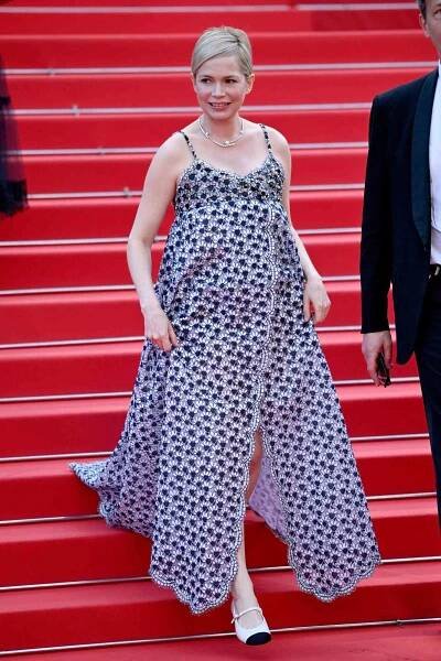 Pregnant Michelle Williams Wraps Her Baby Bump in Florals at Cannes Film Festival Premiere