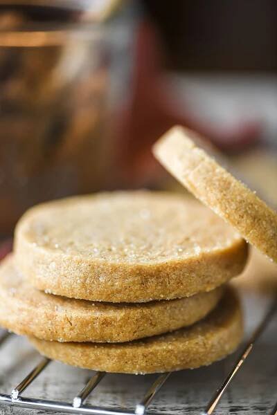 brown sugar shortbread cookies stacked on a rack.