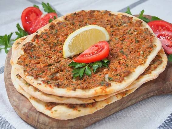Lahmacun or Turkish flatbread is an easy and delicious dish - a thin base topped with a deliciously seasoned meaty topping. Perfect finger food.