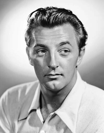 Portrait photo of movie star, tough guy, Hollywood actor, rebel, antihero Robert Mitchum