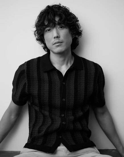 Justin H Min (The Umbrella Academy) talks to Bustle about his latest movie, 'The Greatest Hits.'