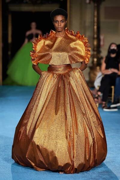 Image may contain Human Person Clothing Apparel Fashion Evening Dress Gown Robe Wedding Gown and Wedding