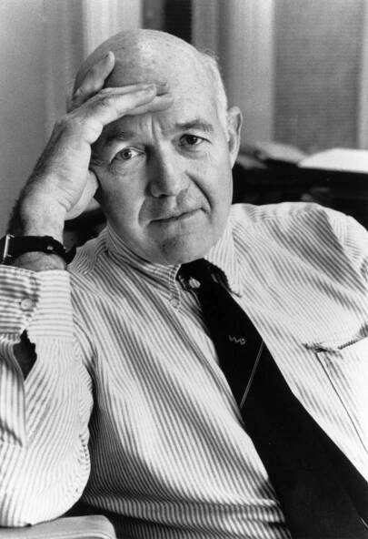 Black and white portrait of James S. Coleman resting his hand on his forehead
