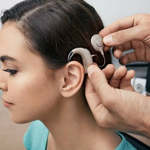 Woman with cochlear implant