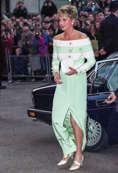 the princess of wales is wearing a green and white dress