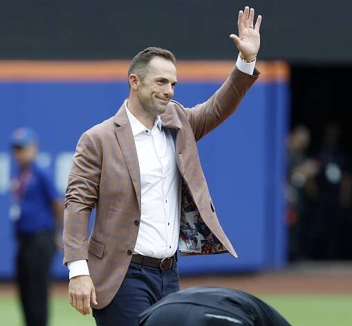 David Wright waves to fans from third base on the field at Cit Field for David Wright Day at Citi Field in Queens, New York.
