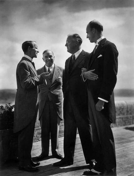Franklin Delano Roosevelt was the first American President to pay an official visit to the Dominion of Canada. There to greet him and his son, James Roosevelt, were: Lord Tweedsmuir, Governor General of Canada; and Prime Minister William Lyon Mackenzie King.