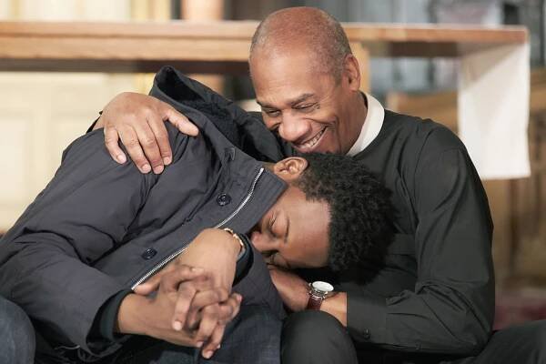Brandon Micheal Hall (left) and Joe Morton share a warm moment on the set of “God Friended Me.”