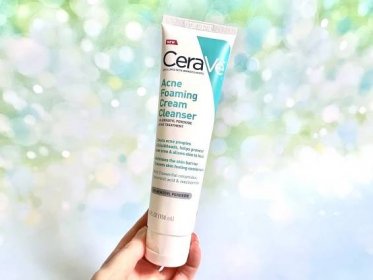 CeraVe Acne Foaming Cream Cleanser, handheld.