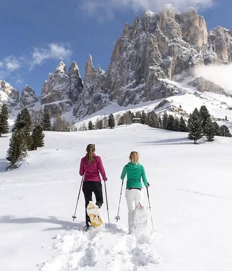 Snowshoe hiking in deep snow, Seiser Alm