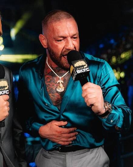 Conor McGregor speaking into a microphone.