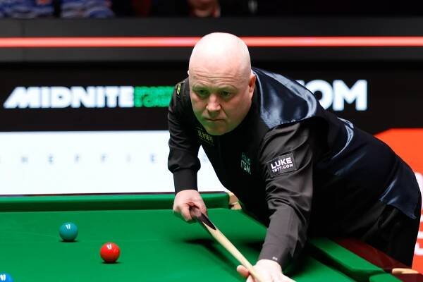 John Higgins of Scotland playing snooker.