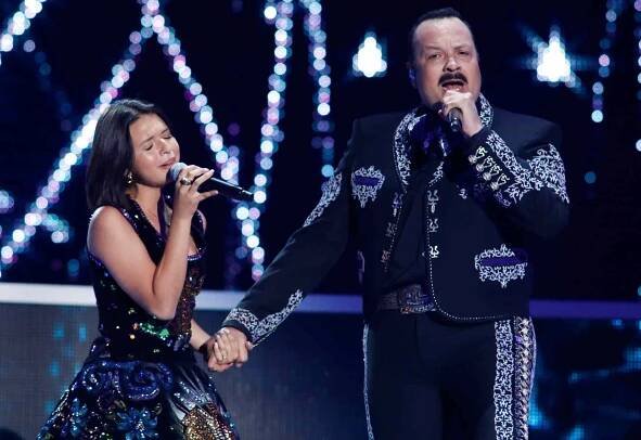 Angela Aguilar and Pepe Aguilar perform on stage during the 2017 Premios Tu Mundo at the American Airlines Arena in Miami, Florida on August 24, 2017. 