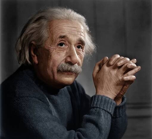 an old man with a moustache holding his hands together