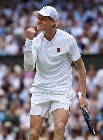 Jannik Sinner of Italy celebrates a tennis match victory.